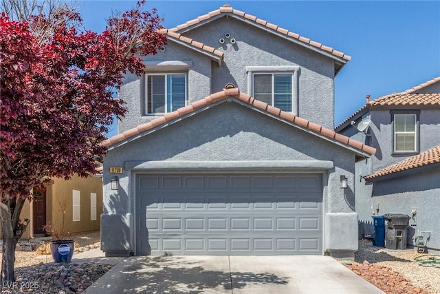 11739 Village Arbor St, Las Vegas, NV 89183 - view of front of home featuring a tiled roof, driveway, and stucco siding