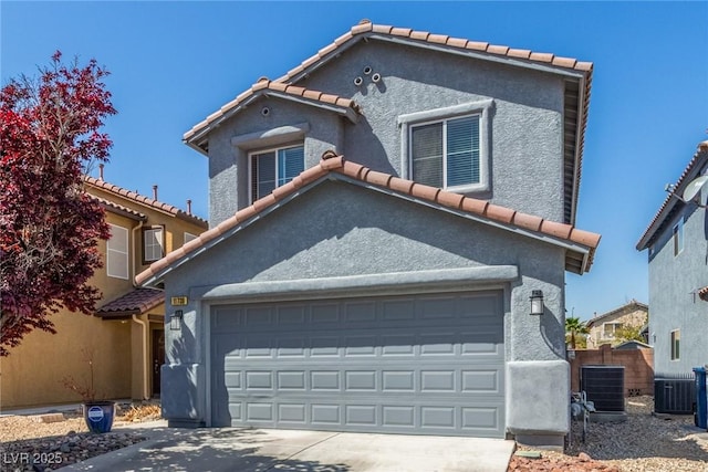 11739 Village Arbor St, Las Vegas, NV 89183 - view of front of home with a tiled roof, concrete driveway, and stucco siding