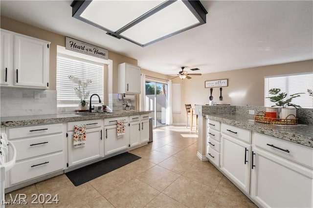 4209 Glass Lantern Dr, North Las Vegas, NV 89032 - kitchen with a sink, a ceiling fan, and white cabinets