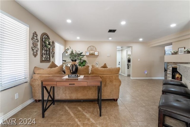 4209 Glass Lantern Dr, North Las Vegas, NV 89032 - living room with recessed lighting, light tile patterned flooring, a fireplace, and baseboards