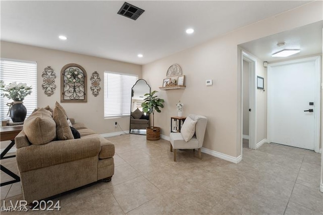 4209 Glass Lantern Dr, North Las Vegas, NV 89032 - living area with light tile patterned floors, plenty of natural light, recessed lighting, and baseboards