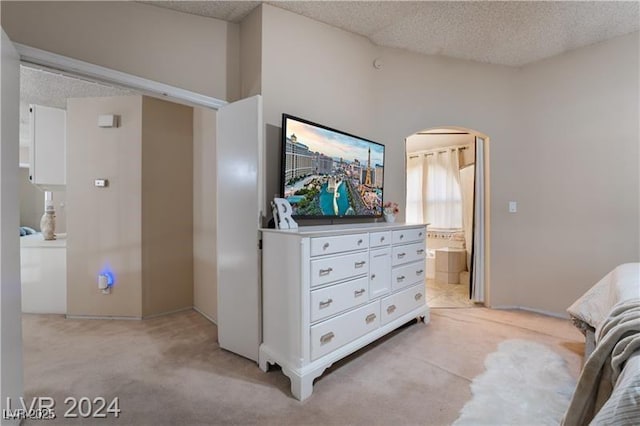4209 Glass Lantern Dr, North Las Vegas, NV 89032 - living room with light colored carpet, arched walkways, and a textured ceiling