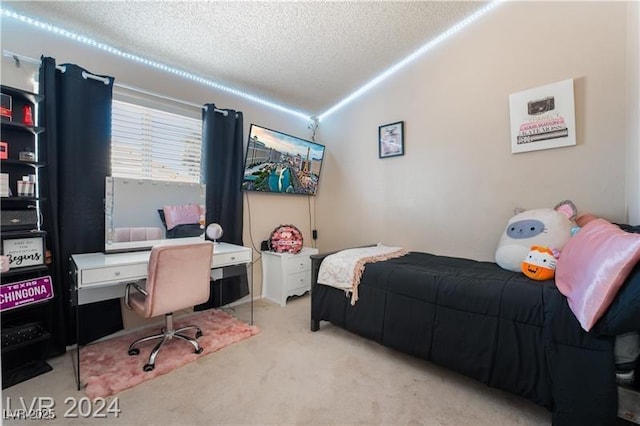 4209 Glass Lantern Dr, North Las Vegas, NV 89032 - bedroom featuring lofted ceiling, carpet floors, a textured ceiling, and a desk