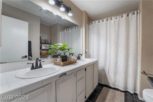 4209 Glass Lantern Dr, North Las Vegas, NV 89032 - bathroom featuring tile patterned flooring, double vanity, and toilet