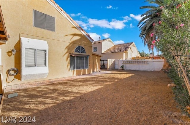 4209 Glass Lantern Dr, North Las Vegas, NV 89032 - rear view of house featuring fence and stucco siding
