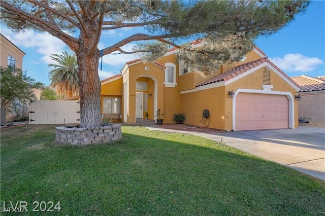4209 Glass Lantern Dr, North Las Vegas, NV 89032 - mediterranean / spanish house with stucco siding, concrete driveway, a garage, and a tile roof