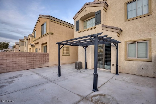 view of patio / terrace with fence, a pergola, and central AC unit