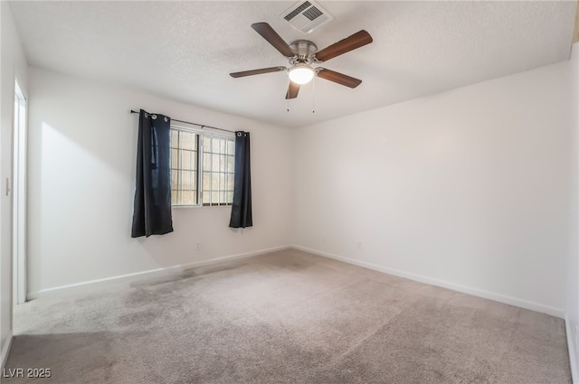 6711 W Charleston Blvd Unit 2, Las Vegas, NV 89146 - spare room featuring carpet, baseboards, a ceiling fan, and a textured ceiling