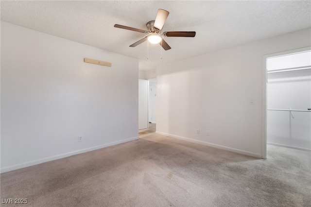 6711 W Charleston Blvd Unit 2, Las Vegas, NV 89146 - carpeted empty room with a ceiling fan, baseboards, and a textured ceiling