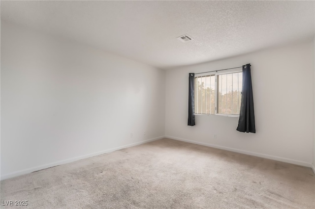 6711 W Charleston Blvd Unit 2, Las Vegas, NV 89146 - spare room with carpet, baseboards, and a textured ceiling