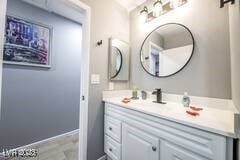 1012 Greystone Dr, Las Vegas, NV 89108 - bathroom with vanity and baseboards