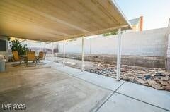 1012 Greystone Dr, Las Vegas, NV 89108 - view of patio featuring fence and outdoor dining area