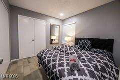 1012 Greystone Dr, Las Vegas, NV 89108 - bedroom with wood finished floors, a closet, and recessed lighting