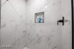 1012 Greystone Dr, Las Vegas, NV 89108 - bathroom with a marble finish shower