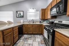 1012 Greystone Dr, Las Vegas, NV 89108 - kitchen featuring black appliances, light stone finish floors, brown cabinetry, light countertops, and a sink