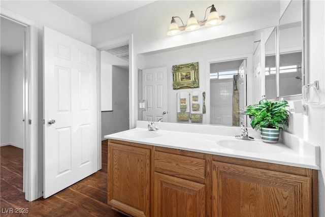4114 Jessica Marie St, North Las Vegas, NV 89032 - bathroom featuring double vanity and wood finished floors