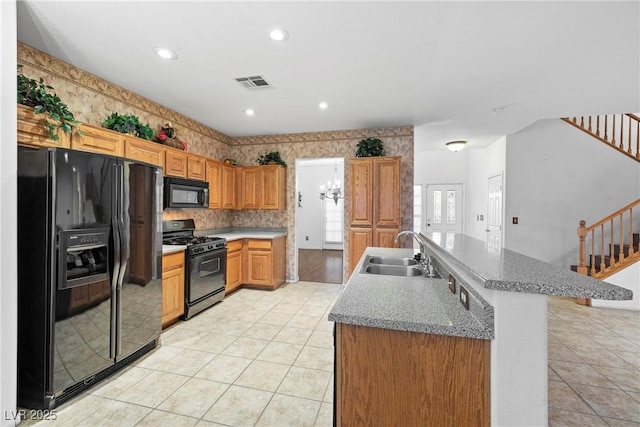 4114 Jessica Marie St, North Las Vegas, NV 89032 - kitchen with black appliances, a sink, light tile patterned flooring, a center island with sink, and recessed lighting