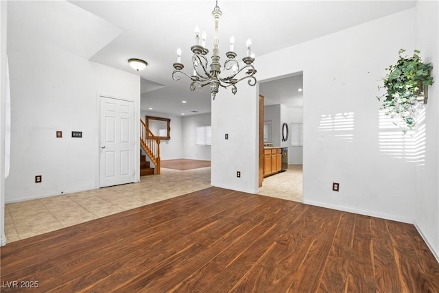 4114 Jessica Marie St, North Las Vegas, NV 89032 - unfurnished room featuring stairway, a chandelier, and light wood-style floors