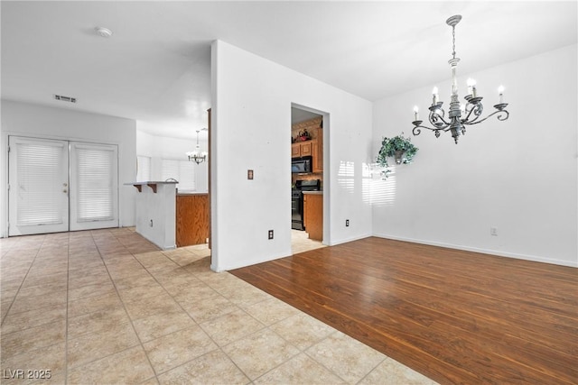 4114 Jessica Marie St, North Las Vegas, NV 89032 - spare room with a chandelier and a smoke detector
