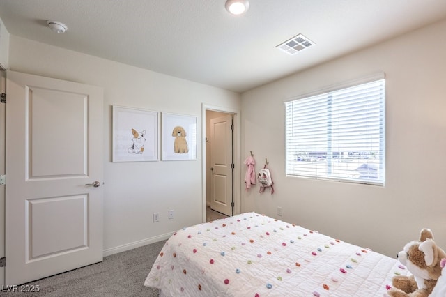 carpeted bedroom with baseboards