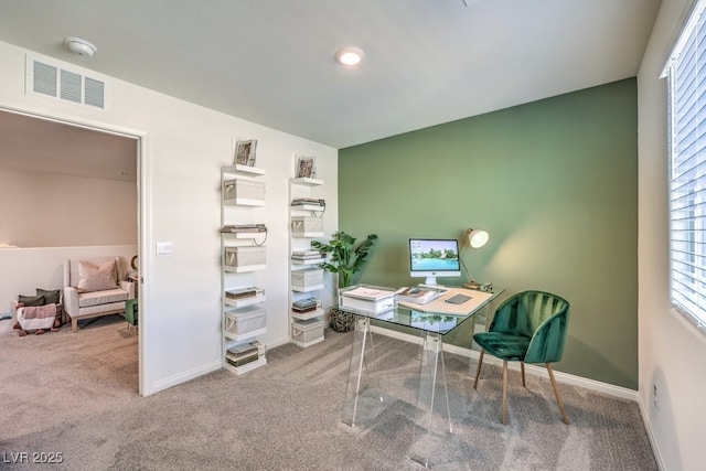 carpeted home office with baseboards and plenty of natural light