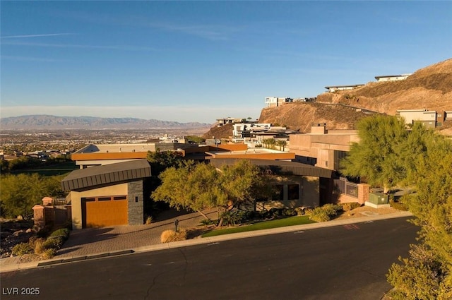 1228 Stellar Rim Ct, Henderson, NV 89012 - pueblo-style house with a mountain view and a garage