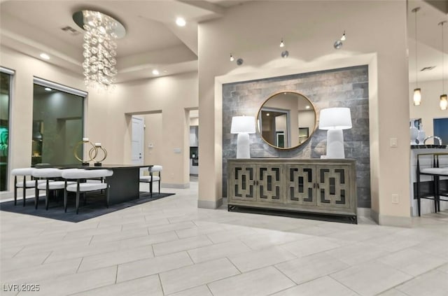 welcome area with a chandelier and recessed lighting