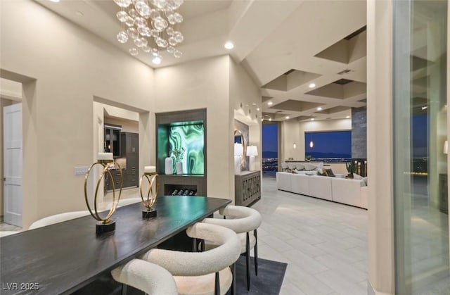 dining space featuring coffered ceiling, a chandelier, and recessed lighting