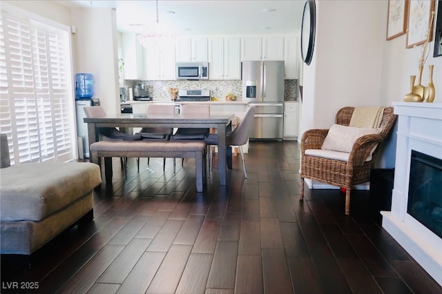 7257 Early Pioneer Ave, Las Vegas, NV 89129 - dining space featuring a chandelier and dark wood finished floors