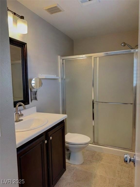 7257 Early Pioneer Ave, Las Vegas, NV 89129 - full bathroom featuring vanity, a stall shower, and toilet