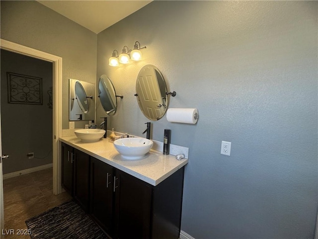 640 House Blend Ln, Henderson, NV 89052 - full bathroom with baseboards and double vanity