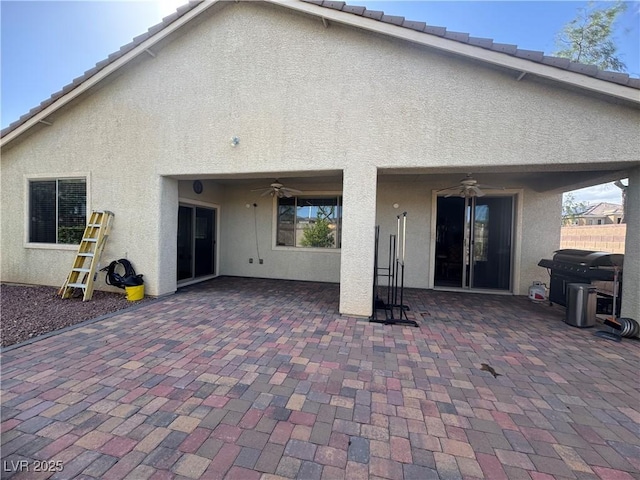 640 House Blend Ln, Henderson, NV 89052 - rear view of property featuring a ceiling fan, stucco siding, a patio, and fence