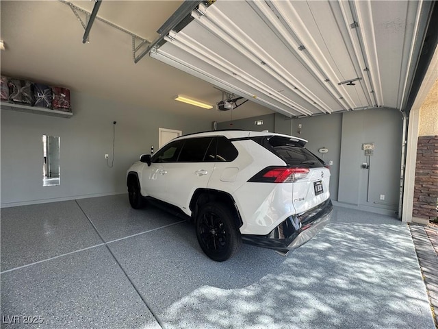 640 House Blend Ln, Henderson, NV 89052 - garage with a garage door opener and baseboards