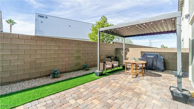 8021 Adelaide Hills St, Las Vegas, NV 89113 - view of patio / terrace with a fenced backyard and outdoor dining area