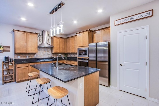 8021 Adelaide Hills St, Las Vegas, NV 89113 - kitchen featuring appliances with stainless steel finishes, wall chimney range hood, a sink, light tile patterned flooring, and decorative backsplash