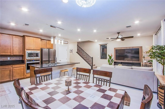 8021 Adelaide Hills St, Las Vegas, NV 89113 - dining space featuring stairway, recessed lighting, a ceiling fan, and light tile patterned floors