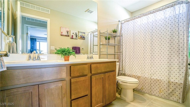 8021 Adelaide Hills St, Las Vegas, NV 89113 - full bathroom featuring toilet, tile patterned floors, and double vanity