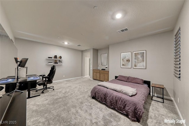 bedroom with light colored carpet, a desk, baseboards, a textured ceiling, and recessed lighting