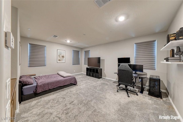 bedroom featuring carpet flooring, baseboards, and an office area