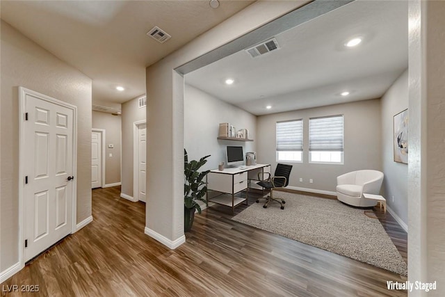 office featuring wood finished floors, baseboards, and recessed lighting