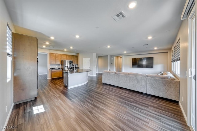 living area with baseboards, recessed lighting, and dark wood-style floors