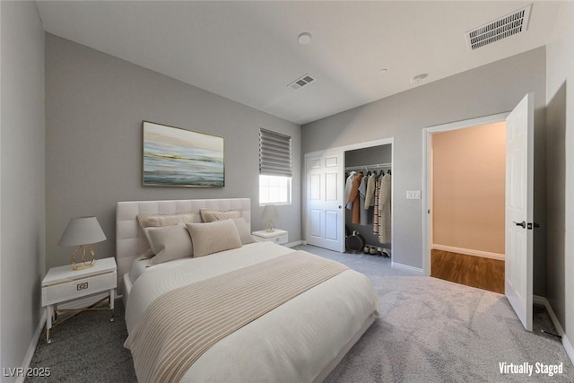 bedroom with carpet, a closet, and baseboards