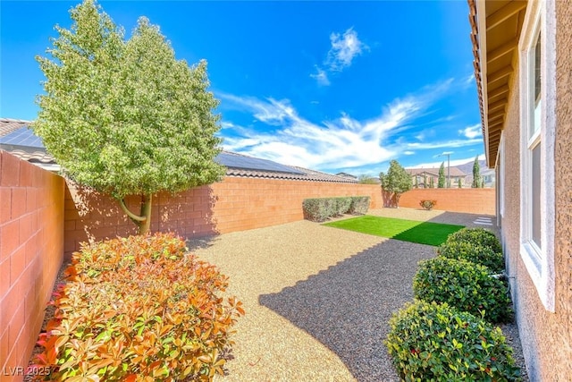 fenced backyard featuring a patio