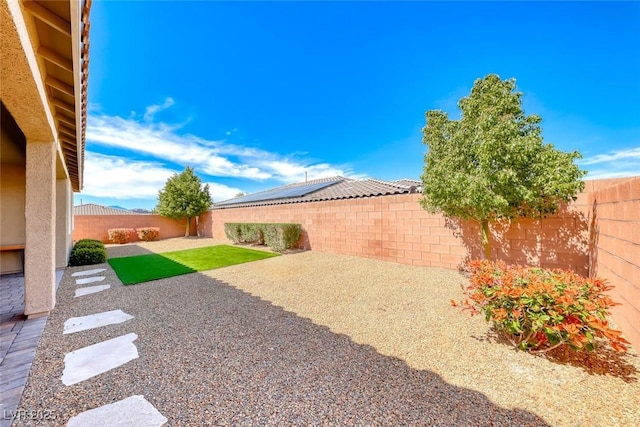 fenced backyard featuring a patio