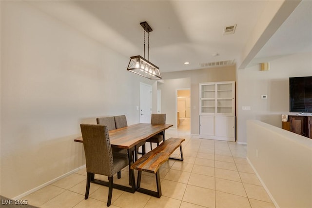 dining area with light tile patterned flooring, recessed lighting, and baseboards