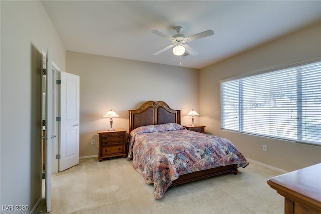 bedroom with light carpet, baseboards, and ceiling fan
