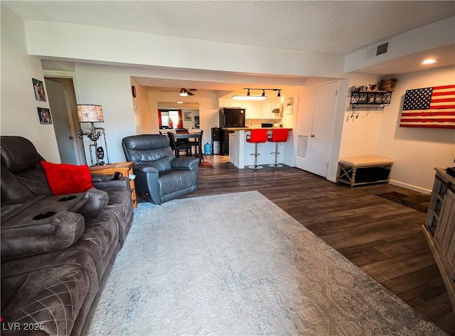 3771 Desert Marina Dr Unit 95, Laughlin, NV 89029 - living area with dark wood finished floors, baseboards, and a textured ceiling