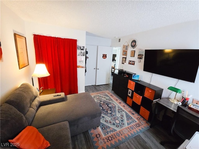 3771 Desert Marina Dr Unit 95, Laughlin, NV 89029 - living room featuring wood finished floors and a textured ceiling