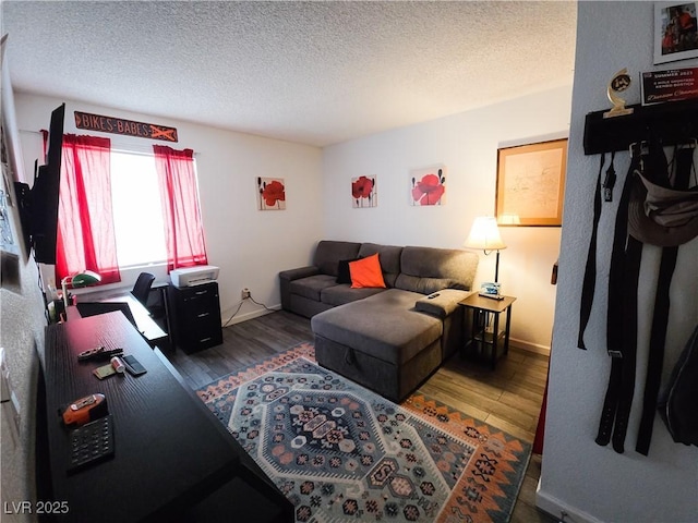 3771 Desert Marina Dr Unit 95, Laughlin, NV 89029 - living room featuring wood finished floors, a textured ceiling, and baseboards
