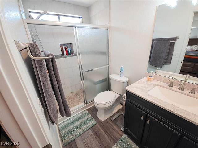 3771 Desert Marina Dr Unit 95, Laughlin, NV 89029 - full bath with toilet, a shower stall, wood finished floors, and vanity